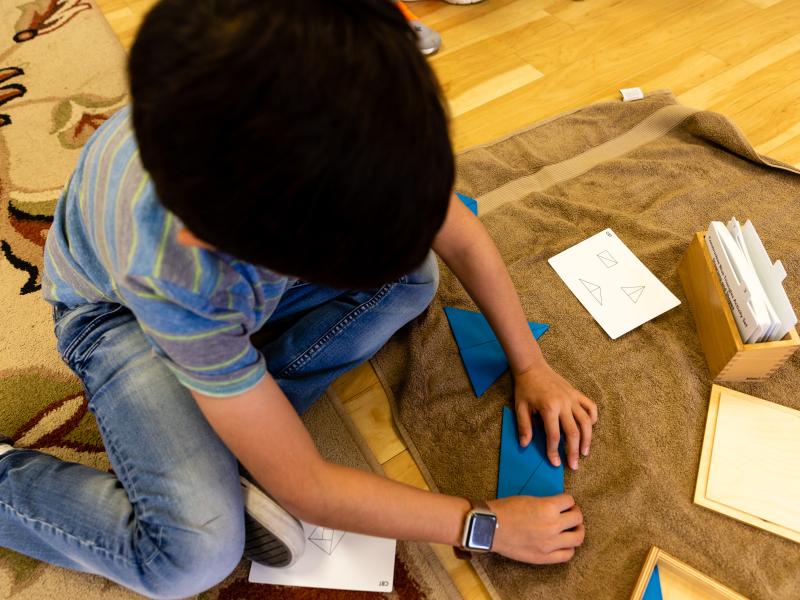 Boy works through puzzles