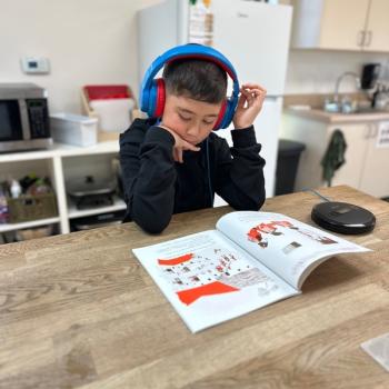 Elementary Child Learning advanced reading at Lifetime Montessori School in San Diego, Highly rated for Best Montessori School in San Diego
