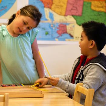 Girl and boy problem solving at Lifetime Montessori School