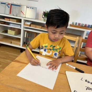 Elementary Child writing at Lifetime Montessori School in San Diego, Highly rated for Best Montessori School in San Diego